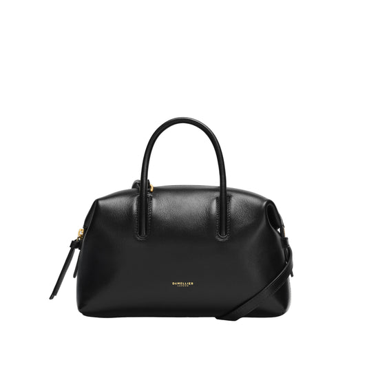 Black handbag with a visible brand logo on a light background